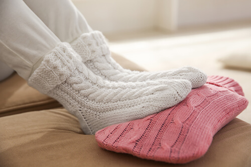 Hot water bottle provides warmth for cold feet