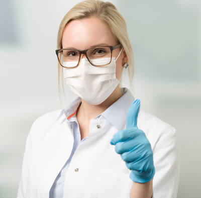 Doctor satisfied with disposable gloves