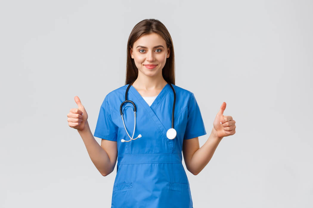 Nurse wears blue tunic scrub
