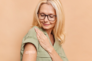 Woman looking at bandage