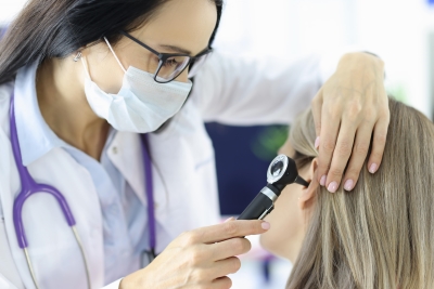 ENT doctor examining the ear